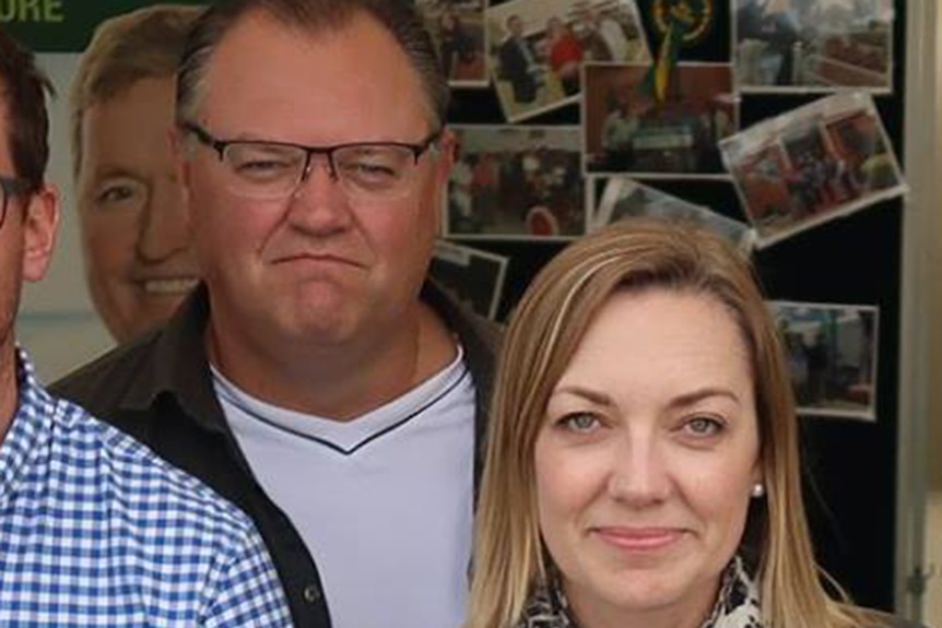 Simon Glossop stands behind Mia Davies at a Nationals event.