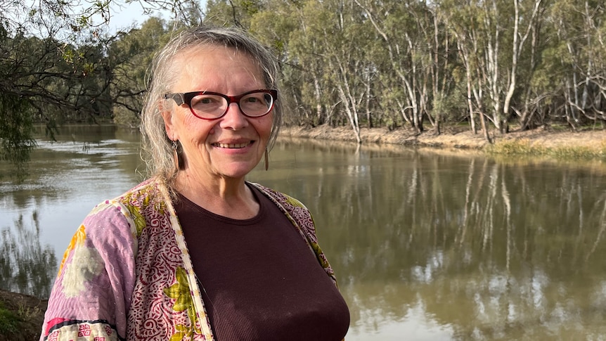 Yasmin Sadler stands on the bank of the Murray River