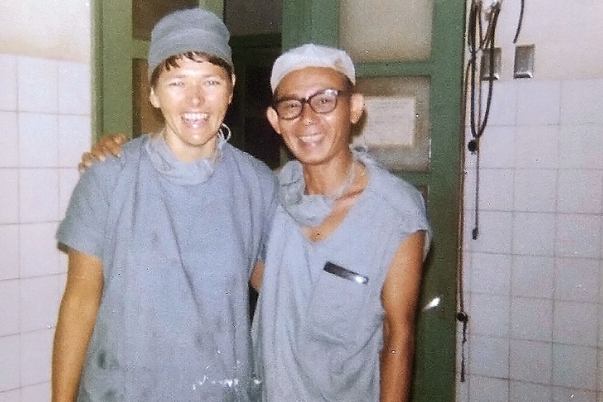 A nurse and doctor in surgical uniform, 1971