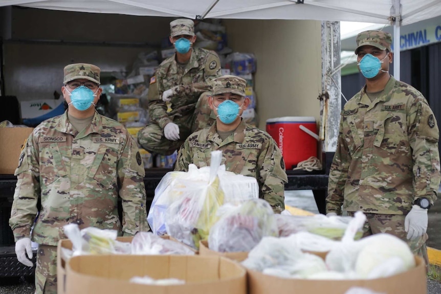 Guam's National Guard hands out packages of non-perishable goods during the coronavirus pandemic.