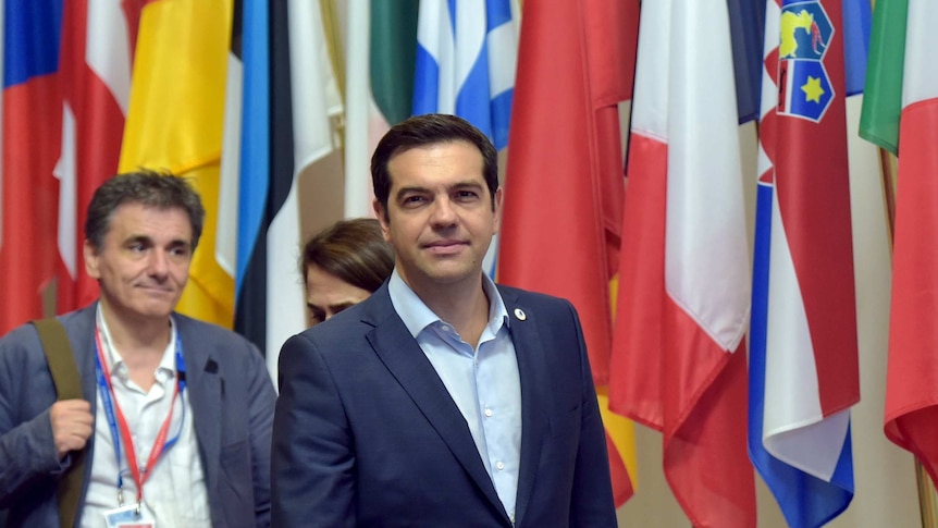 Greece's PM Alexis Tsipras and finance minister Euclid Tsakalotos leave the eurozone leaders summit in Brussels.