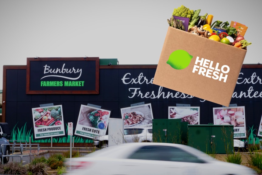 The outside of a large black building with a Bunbury Farmers Market sign and a hello fresh food delivery service box 