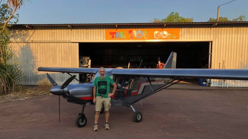 Pilot John Gotts who was killed in a Darwin plane crash stands with his aircraft