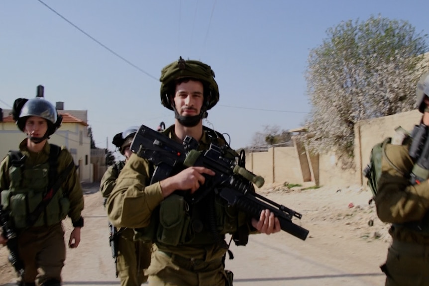 Soldiers patrolling in the Palestinian village of Kafr Qaddum.