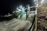 Water flows over spillway of Ross River Dam between Kelso and Mount Stuart in Townsville.