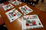 Carnations and print copies are seen in the newsroom of Cumhuriyet newspaper.