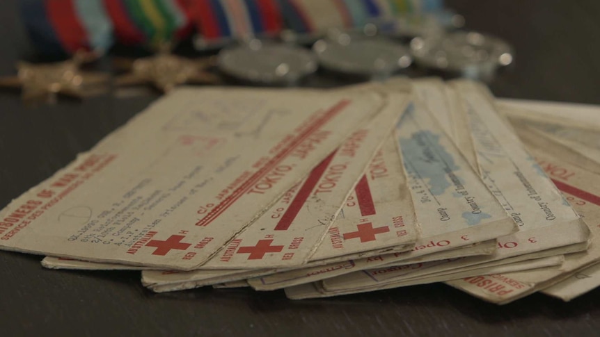Bob Christie's Red Cross letters spread out across a desk