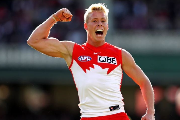 Isaac Heeney pumps his fist to celebrate a goal
