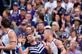Caught on camera ... Ryan Crowley threw his head back after some minor contact from the Crows.