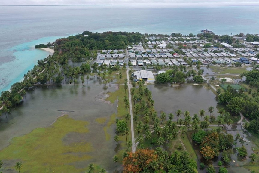 Aerial view of houses and island flooded. 