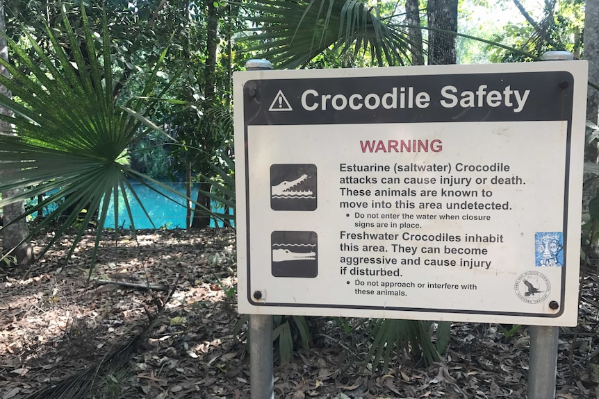 A sign warning of the possible presence of crocodiles at the Berry Springs swimming hole.