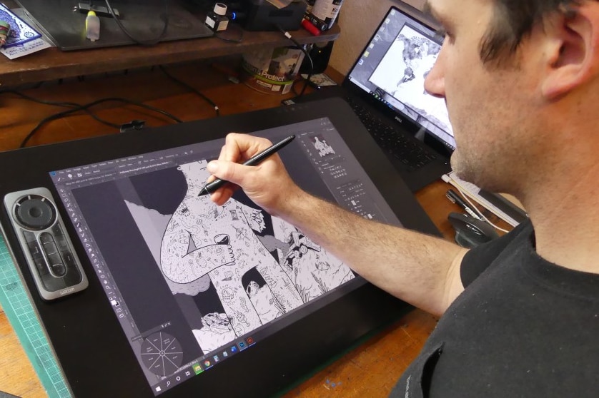 Illustrator Josh Pringle draws in his home studio.