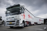 The front of a Redstar Transport truck with Redstar written on the side