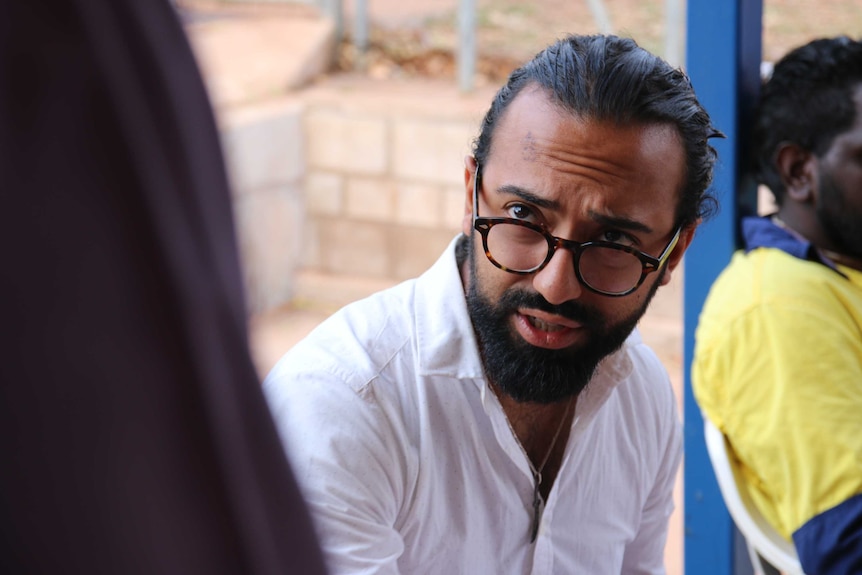 NAAJA solicitor Jalal Razi negotiates with the prosecutor outside Bush Court in Wadeye