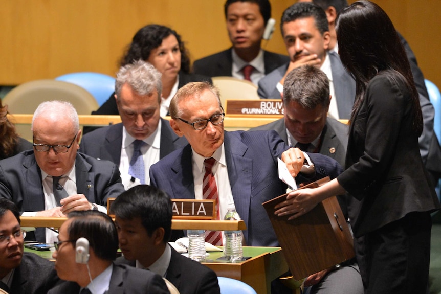 Bob Carr casts his vote during the ballot at the United Nations General Assembly in New York.