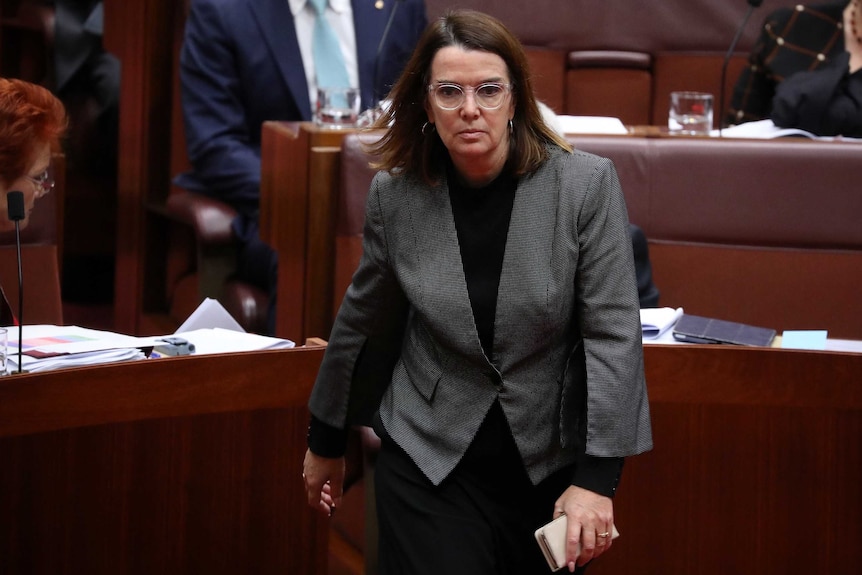 Anne Ruston walks through the Senate chamber.