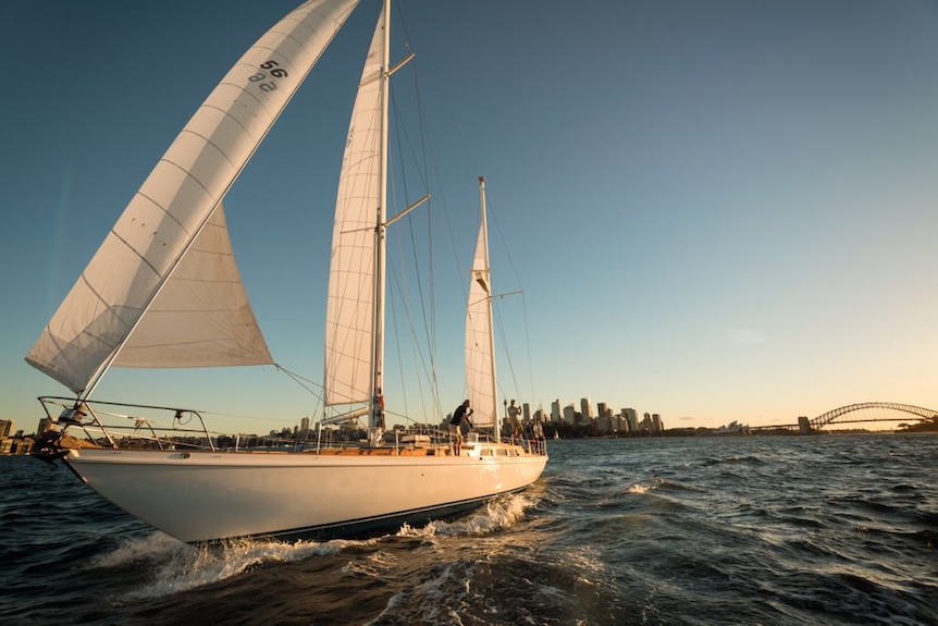 Southwinds sails with the Sydney CBD and Harbour Bridge in the background.