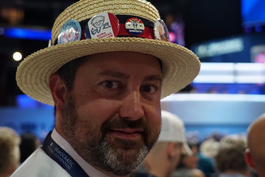 Brent Olsen wears a decorated boater hat at the Democratic Convention.