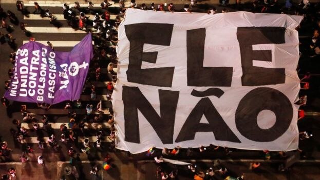 Huge #EleNao banner from above in the women's march against Jair Bolsonaro in Brazil