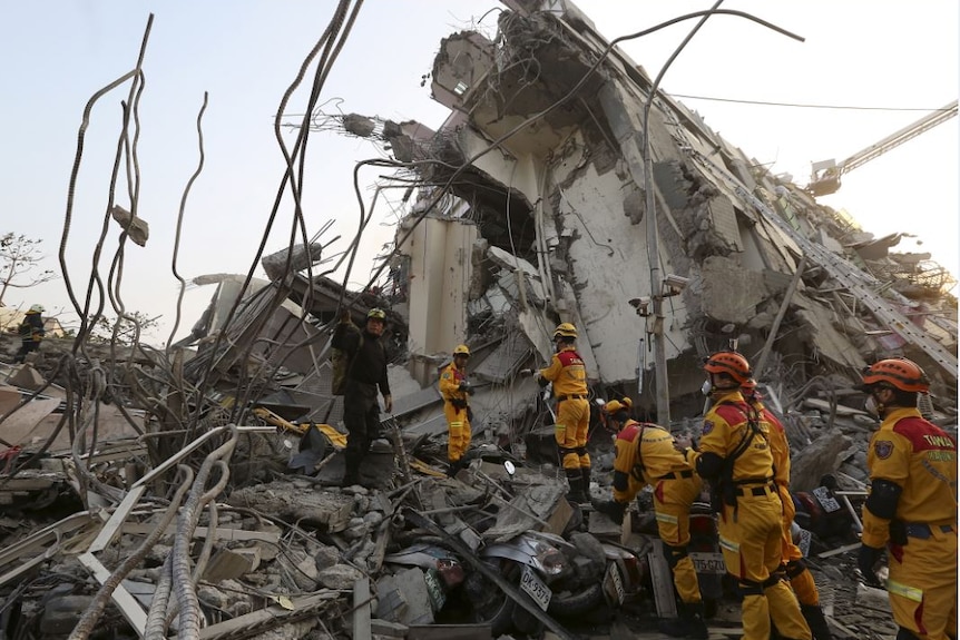 Earthquake rescue personnel at Taiwan apartment building collapse