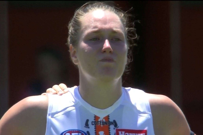 GWS Giants ruck Erin McKinnon cries before an AFLW game against Fremantle Dockers.