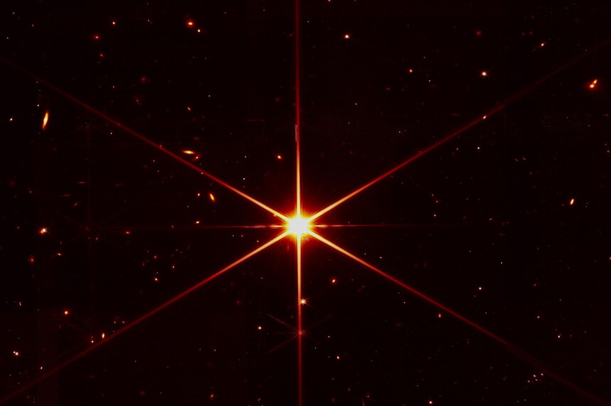 Bright star surrounded by galaxies in infrared