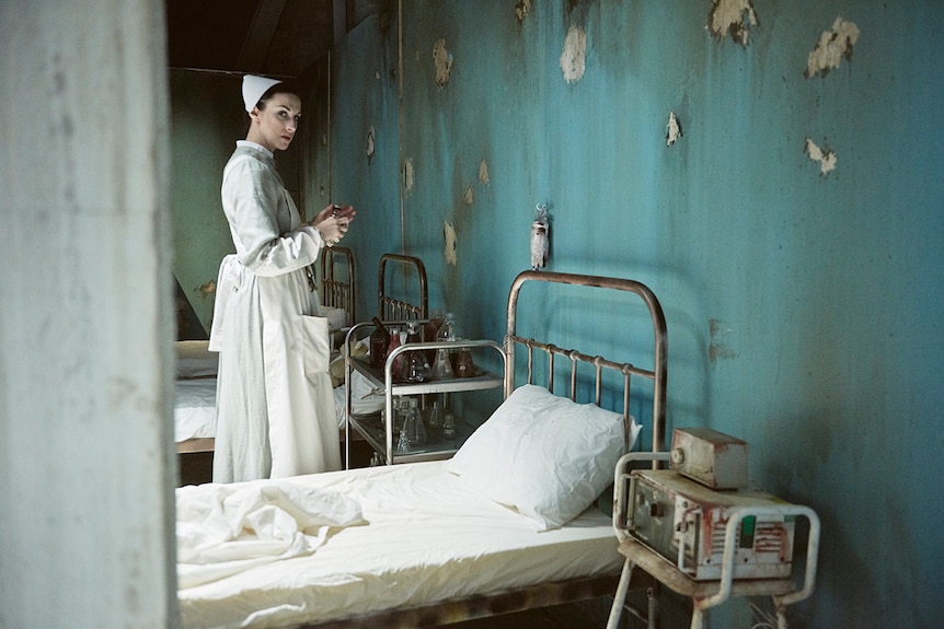 Colour photo of Hannah Raven as Ligeia dressed as a nurse in immersive theatre production A Midnight Visit.