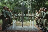 Australian soldiers erect a cross to commemorate the battle of Long Tan on August 18, 1969.
