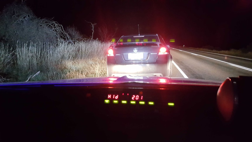 The Holden Commodore sedan pulled over on the Horrocks Highway.