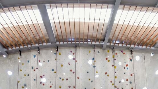 The climbing wall is lit up in the Berry Sport and Recreation Centre