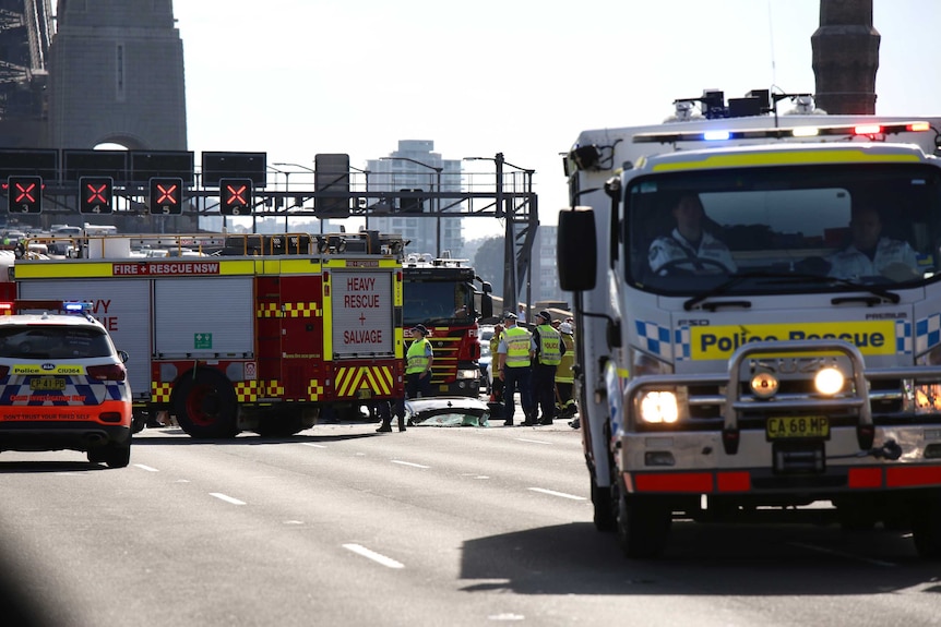 Emergency services with a smashed windscreen visible