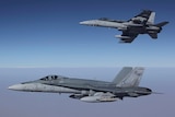 FA-18A Hornets from Australia's Air Task Group fly in formation with a Royal Australian Air Force KC-30A Multi Role Tanker Transport aircraft during the first mission of Operation OKRA to be flown over Syria