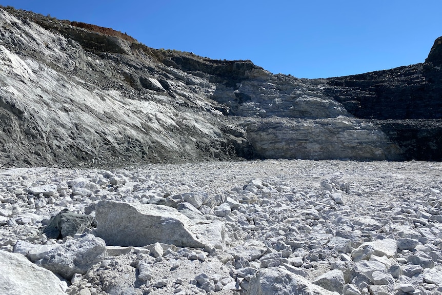 A mining pit full of pale rubble.