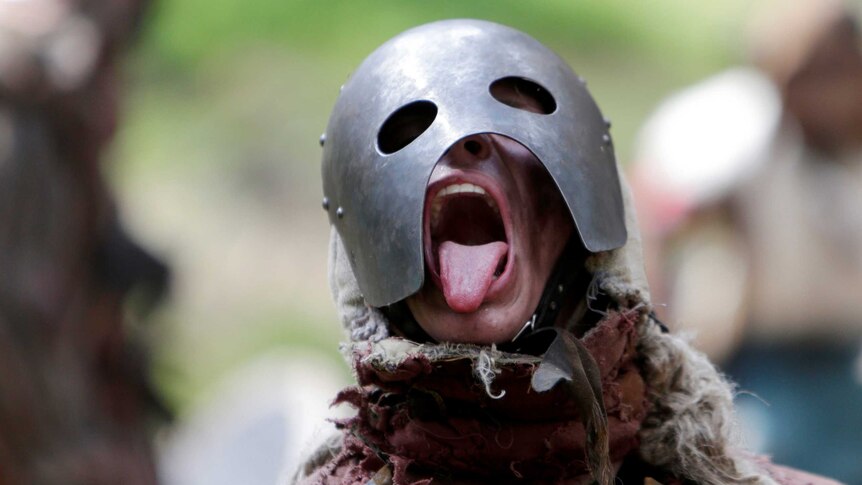 A person wears steel armour as part of a re-enactment of a battle from J.R.R Tolkiens "The Hobbit" series.