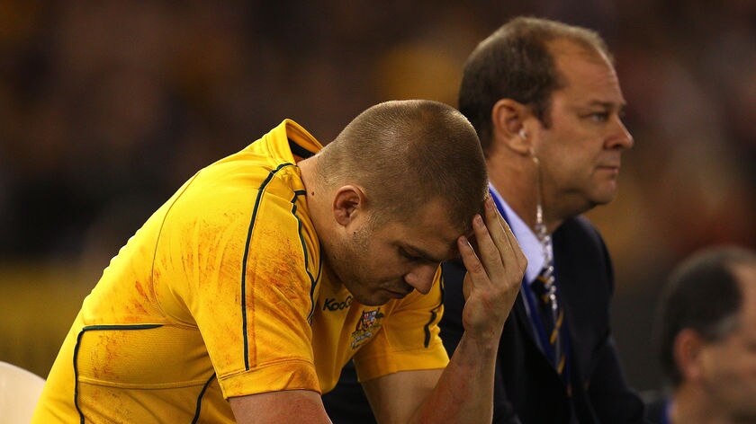Drew Mitchell sits forlorn on the sidelines after being sent off