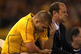 Drew Mitchell sits forlorn on the sidelines after being sent off