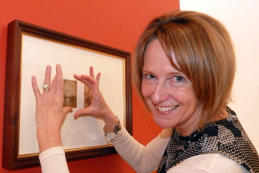 Dr Sarah Engledow, Senior Historian at the National Portrait Gallery with the carte de visite of Master Johnny Day.