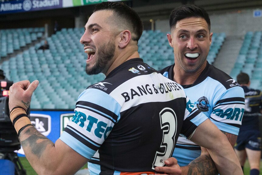 Jack Bird gets a pat on the back as he clenches his first in celebration of a try.