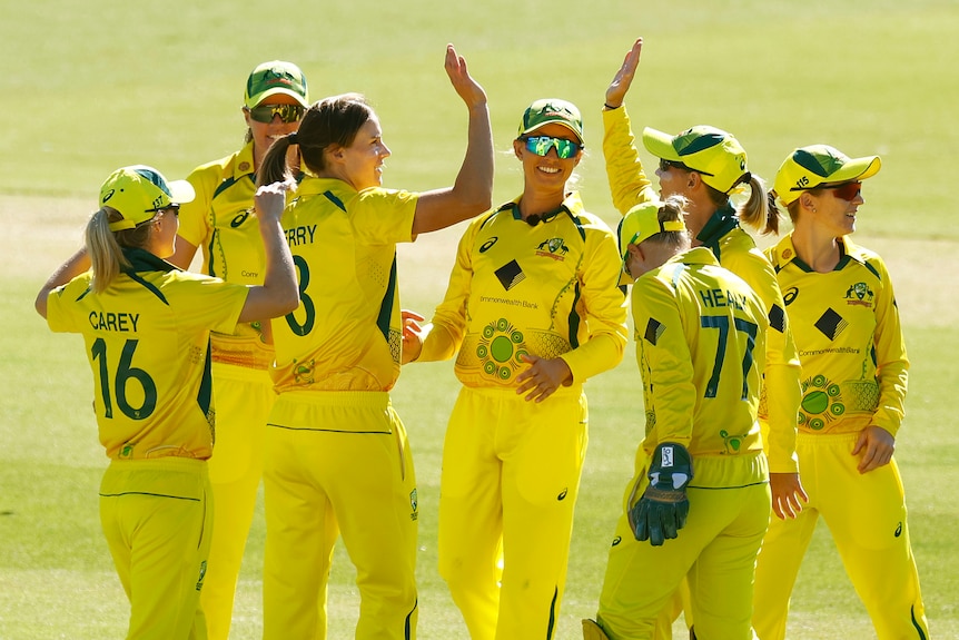 Ellyse Perry of Australia celebrates with teammates after bowling out Emma Lamb of England in the Ashes series