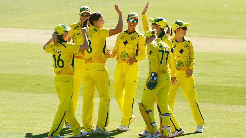 Ellyse Perry of Australia celebrates with teammates after bowling out Emma Lamb of England in the Ashes series
