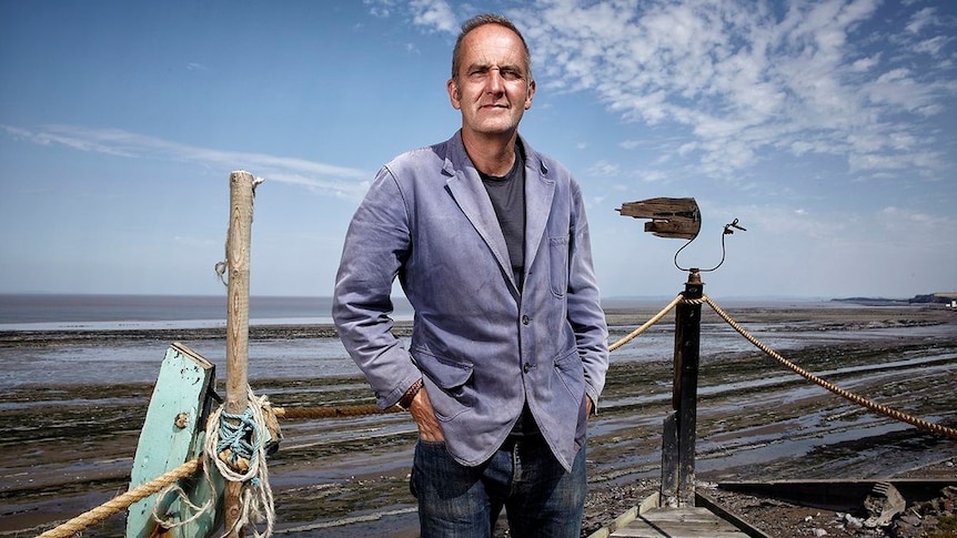 Grand Designs host Kevin McCloud on the beach.