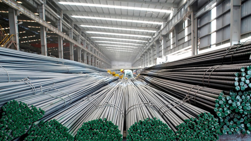 Worker in Vietnam steel mill.