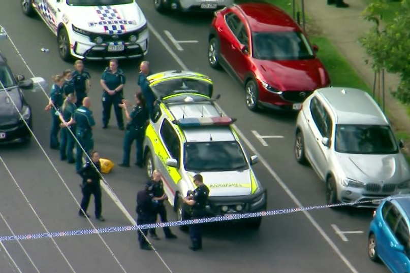 Aerial of police and ambulance officers at the scene of South Brisbane shooting