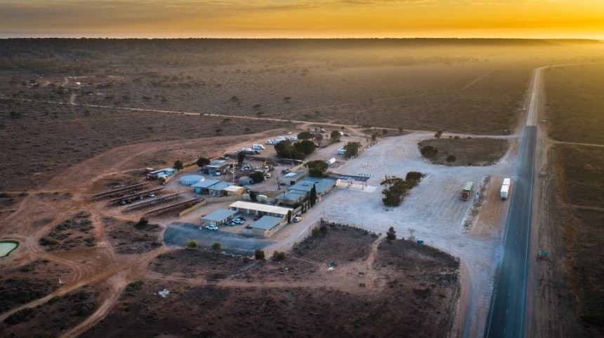 An aerial photograph of a roadhouse on the remote Nullarbor Plain.