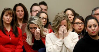 Victims and others look on as Rachael Denhollander speaks at the sentencing hearing for Larry Nassar
