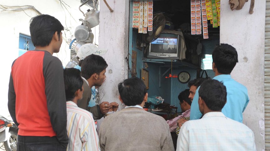 Indians watching the results of the Member of Legislative Assembly election in Amritsar on March 6, 2012