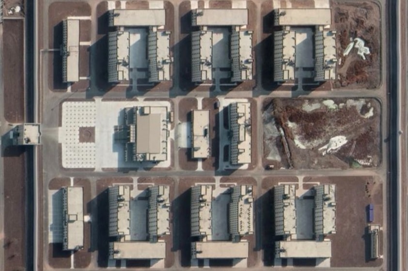 A huge detention complex in Xinjiang seen by satellite, it has a high perimeter wall with watchtowers.