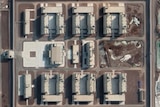 A huge detention complex in Xinjiang seen by satellite, it has a high perimeter wall with watchtowers.