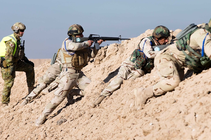 An Australian soldier trains Iraqi soldiers