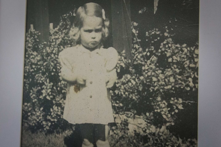 Black and white photo of a little girl.